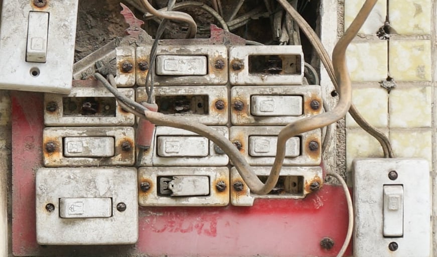 several assorted power switches mounted on white wall