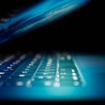 Closeup photo of turned-on blue and white laptop computer