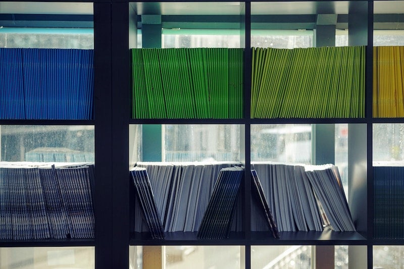 Colourful book case with paper files