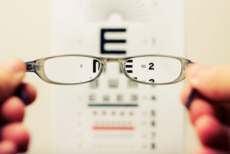 glasses in front of an eye chart