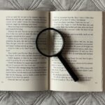 Magnifying glass on a book.