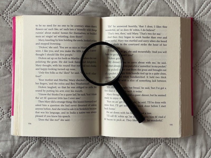 Magnifying glass on a book.